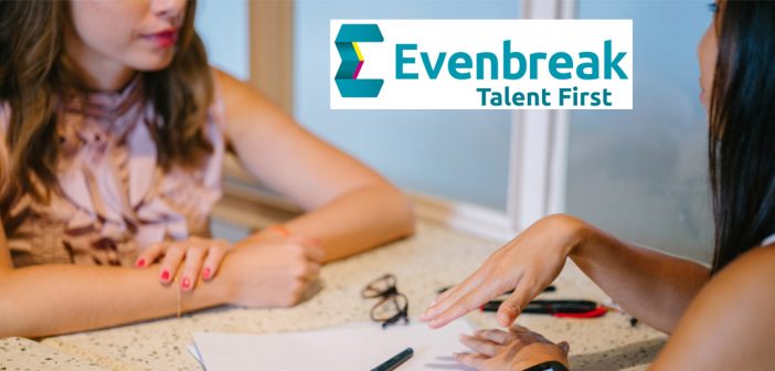 Two girls chatting over a table
